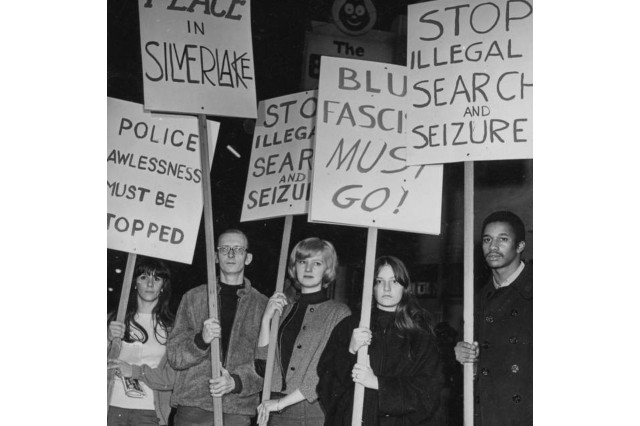 Black Cat Protesters with sign in the background