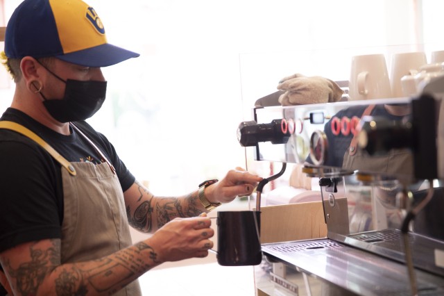 barista making coffee