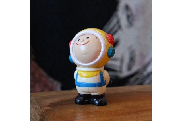 plastic figure of boy in helmet 