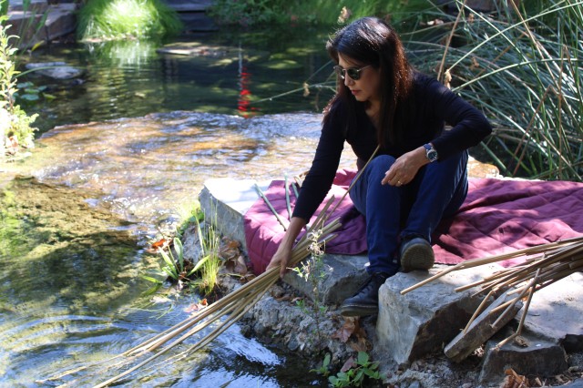 woman soaks plants in water 