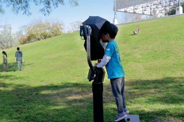 Kid looking through AR viewing tool