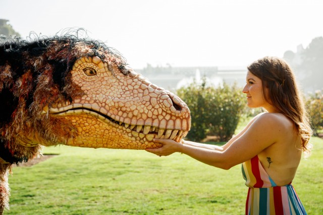 Hunter the T. rex puppet outside in Exposition Park&#039;s Rose Garden