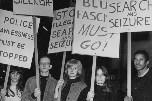 Black Cat Protesters with sign in the background