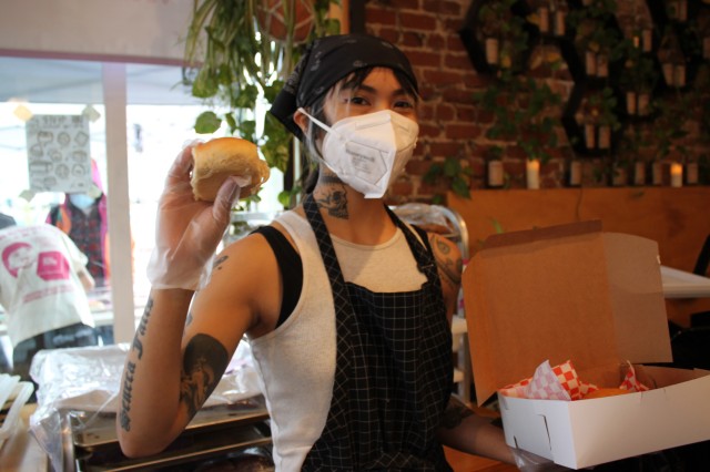 woman holding bread in hand