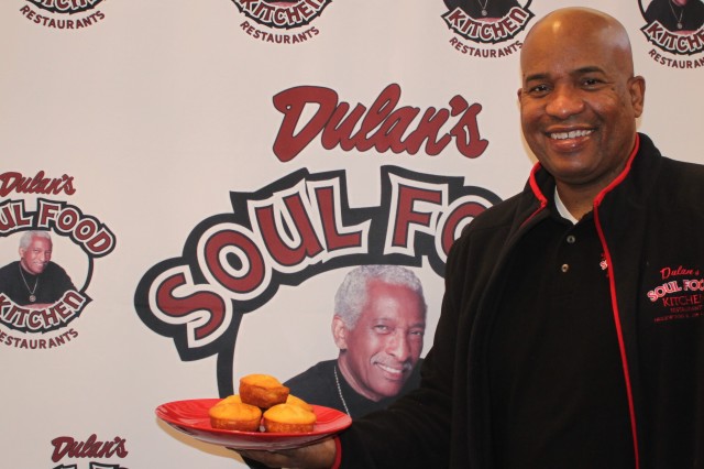 Terry Dulan holding a plate of cornbread