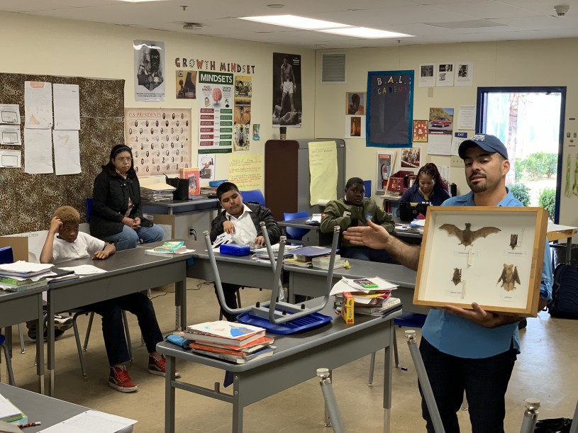 Miguel Ordeñana holds up a box of bat specimens at BALA