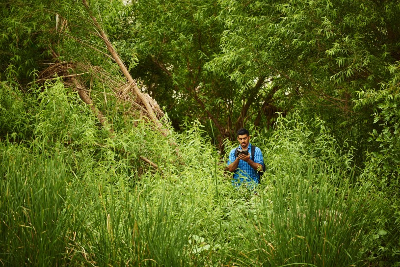 Miguel Ordeñana using motion-sensing camera traps along the river