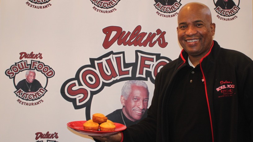 Terry Dulan holding a plate of cornbread