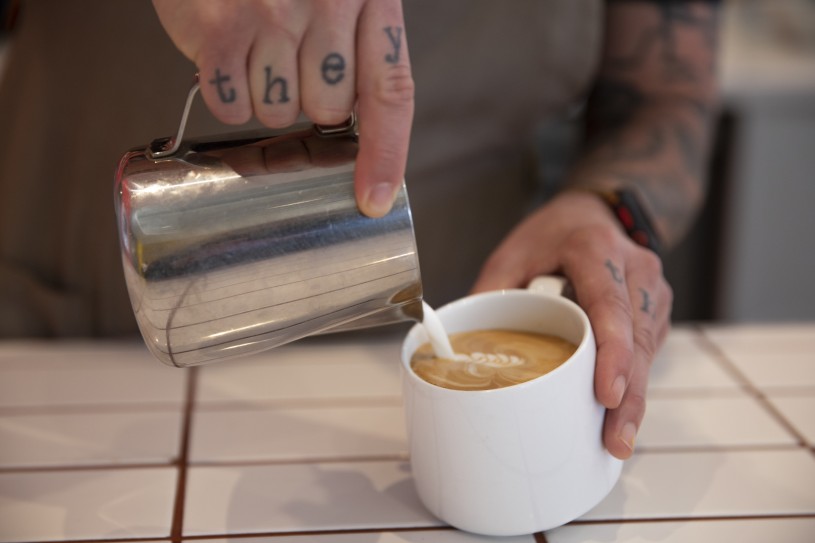 hands pouring coffee 