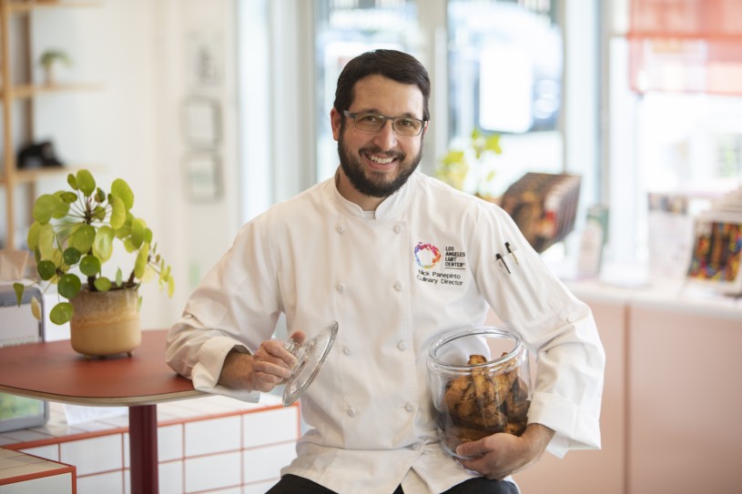 Chef holding biscotti in jar